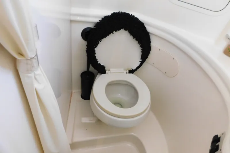 Slide: The Image of Toilet area in 2001 Sea Ray 300 Sundancer boat bathroom. - 60