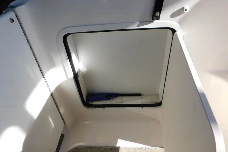 Slide: The Image of Storage compartment on a 2001 Sea Ray 300 Sundancer boat. - 18