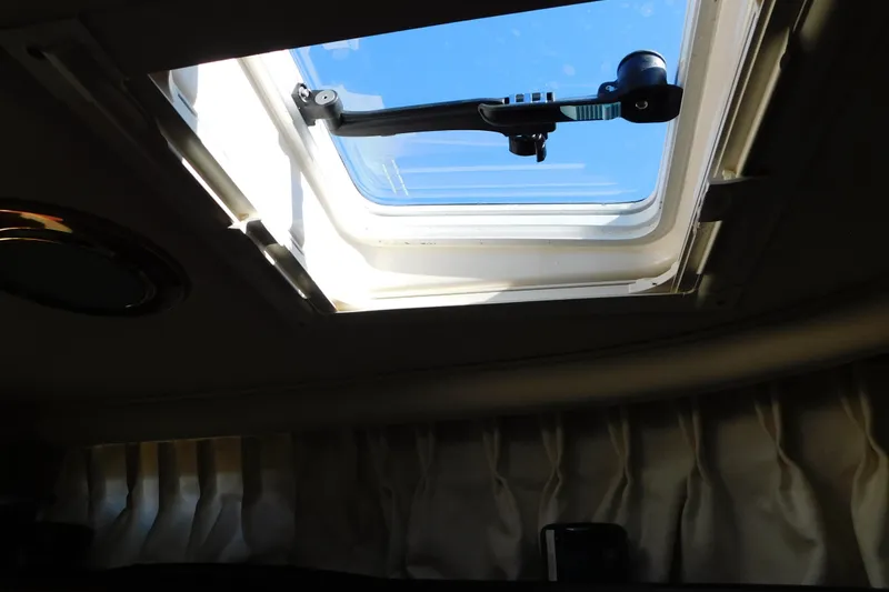 Slide: The Image of Cabin skylight view inside 2001 Sea Ray 300 Sundancer boat. - 65