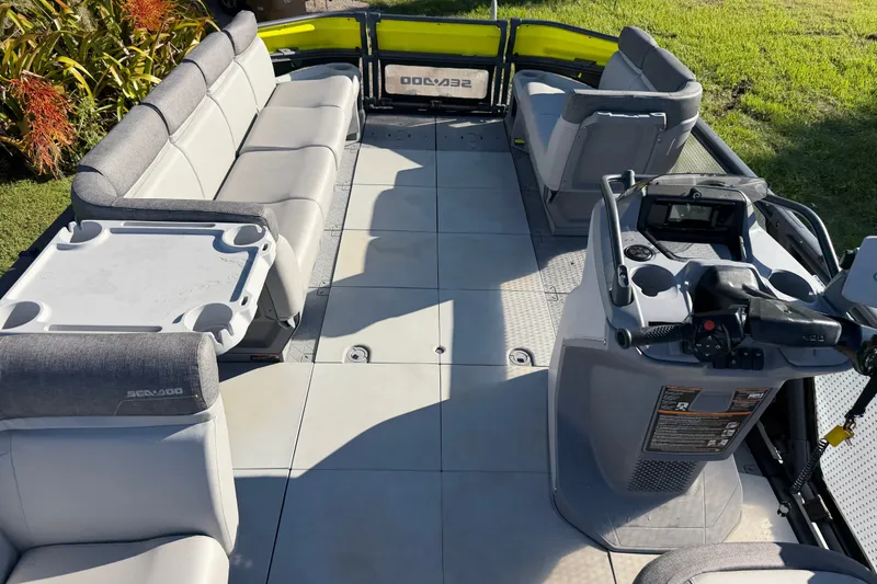 Slide: The Image of 2023 Sea-Doo Switch Sport 21 interior with seating and control console. - 12