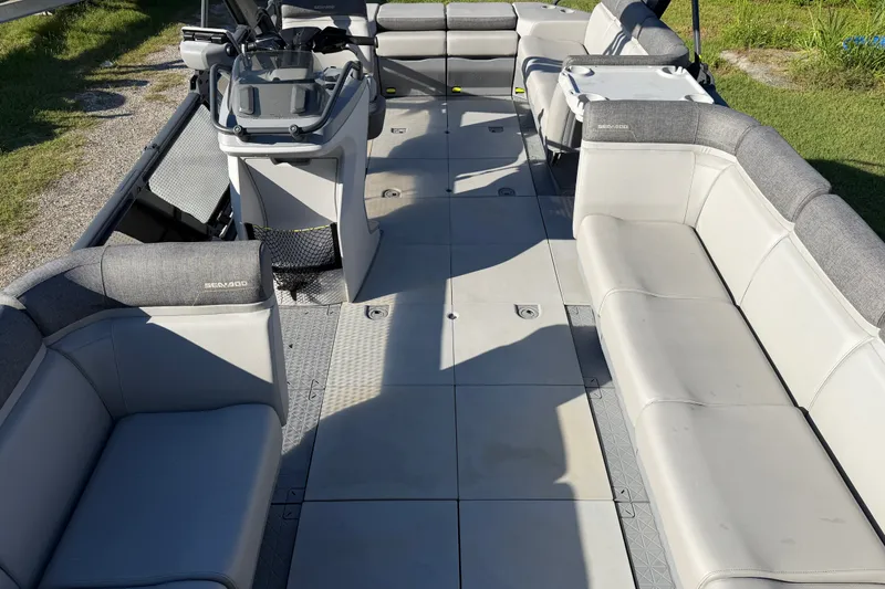 Slide: The Image of 2023 Sea-Doo Switch Sport 21 interior with spacious seating and modern helm. - 9