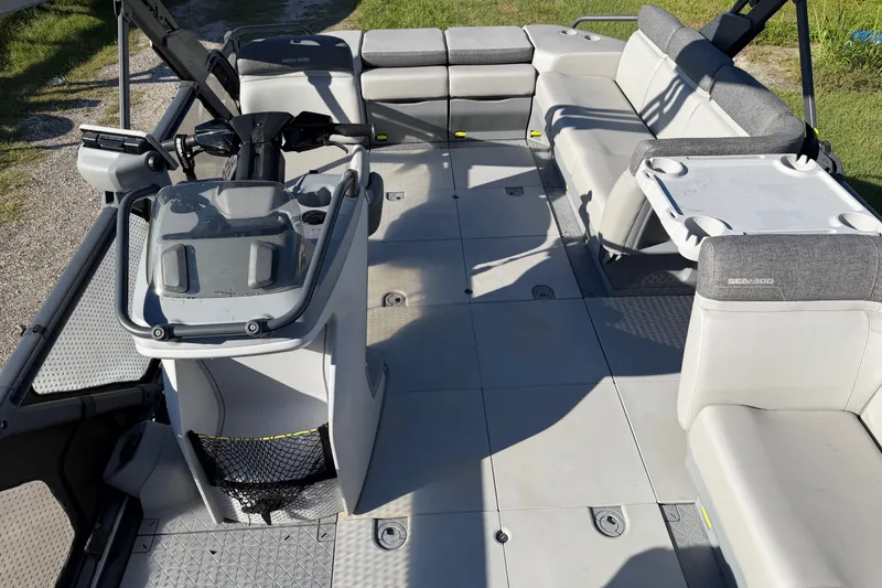 Slide: The Image of 2023 Sea-Doo Switch Sport 21 interior with spacious seating and modern controls. - 11