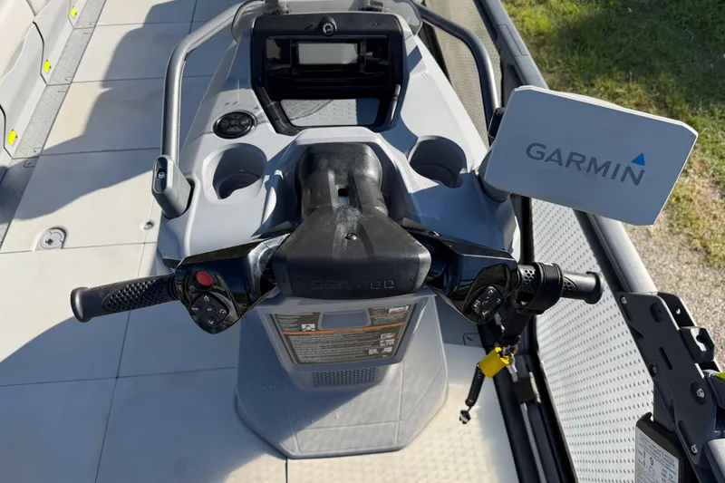 Slide: The Image of 2023 Sea-Doo Switch Sport 21 dashboard with Garmin navigation system and controls. - 7