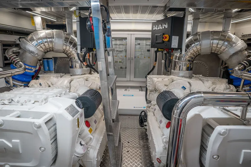 Slide: The Image of Engine room of 2022 Astondoa 66 Fly yacht, featuring dual MAN engines and advanced systems. - 51