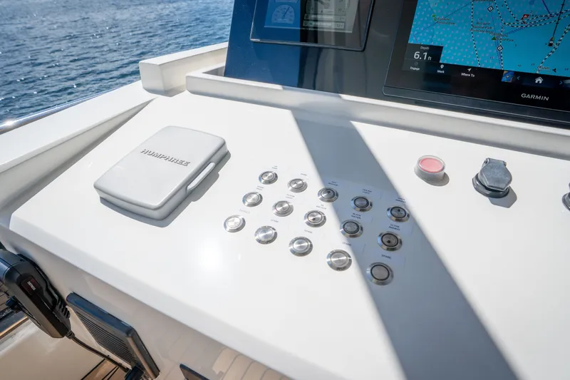 Slide: The Image of Control panel of 2022 Astondoa 66 Fly yacht with navigation display and buttons. - 16