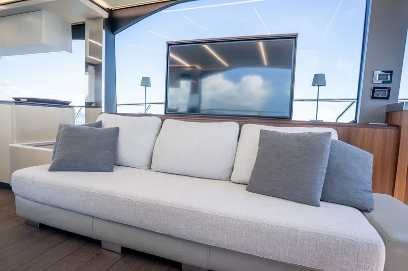 Slide: The Image of Luxurious interior of 2022 Astondoa 66 Fly yacht with modern sofa and large window view. - 28