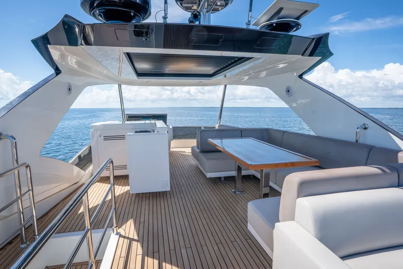 Slide: The Image of Luxurious 2022 Astondoa 66 Fly yacht deck with elegant seating and ocean view. - 8