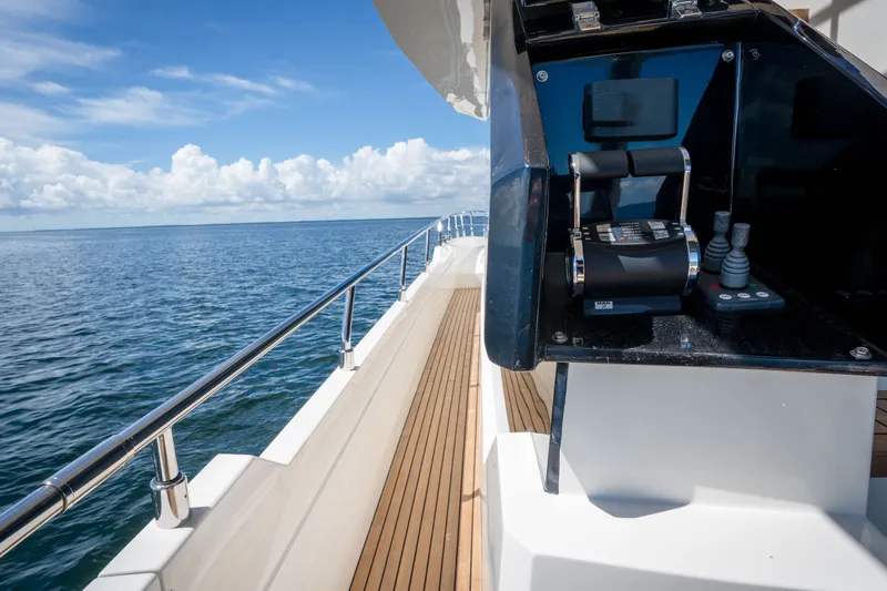 Slide: The Image of Astondoa 66 Fly 2022 yacht deck with control panel, overlooking the ocean. - 18