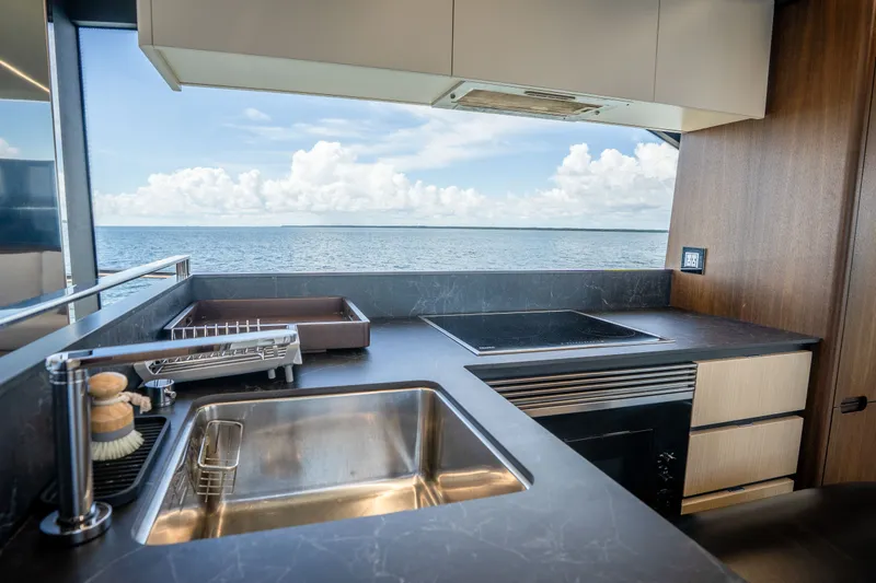 Slide: The Image of Modern kitchen interior on 2022 Astondoa 66 Fly yacht with ocean view. - 24