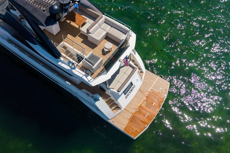 Slide: The Image of Aerial view of 2022 Astondoa 66 Fly yacht on sparkling green water. - 6