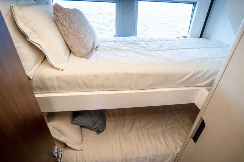 Slide: The Image of Bunk beds in the 2022 Astondoa 66 Fly yacht cabin with ocean view. - 49