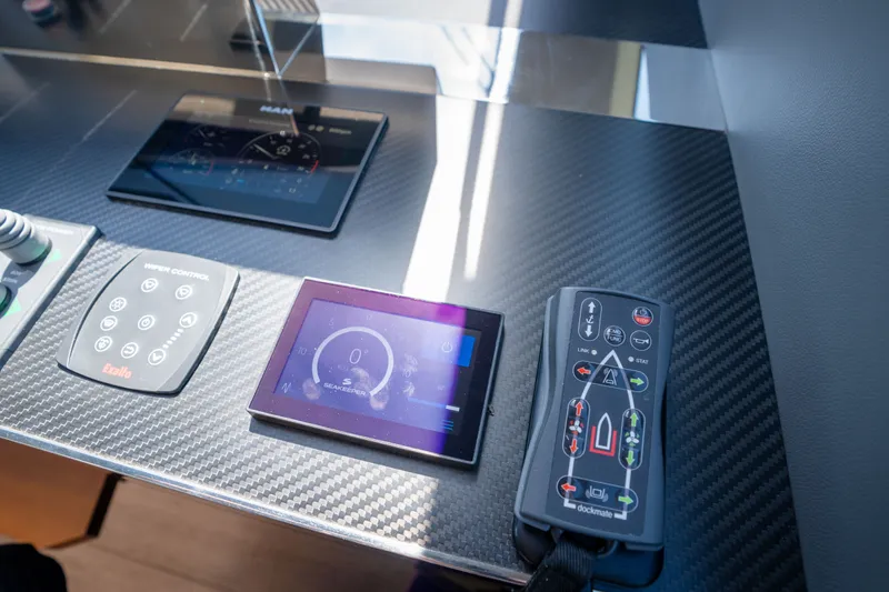 Slide: The Image of Control panel of 2022 Astondoa 66 Fly yacht with advanced navigation displays. - 32