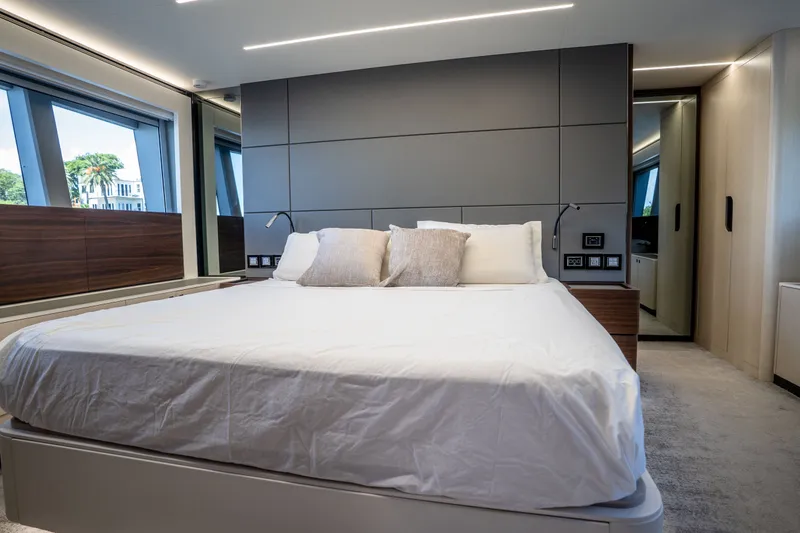 Slide: The Image of Luxurious bedroom interior on 2022 Astondoa 66 Fly yacht, featuring modern design and large windows. - 35