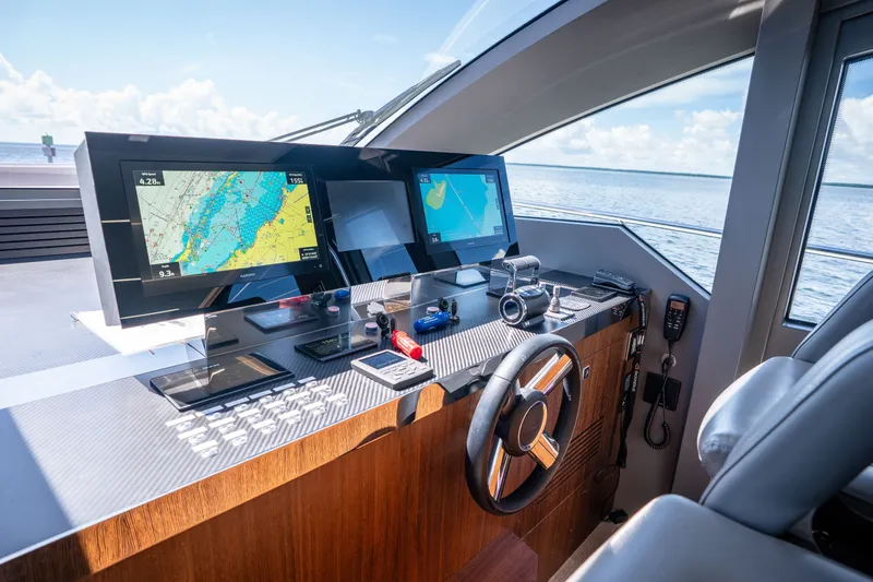 Slide: The Image of Cockpit of 2022 Astondoa 66 Fly yacht with navigation screens and steering wheel. - 29