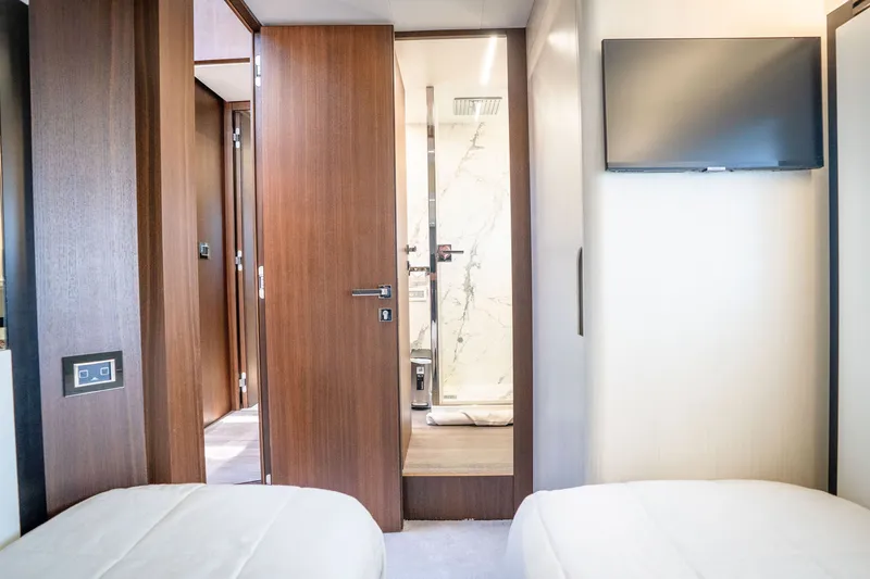 Slide: The Image of Interior of 2022 Astondoa 66 Fly yacht with modern wood finishes and TV. - 46