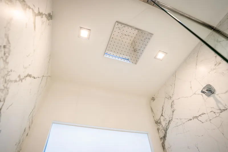Slide: The Image of Luxurious marble shower interior on 2022 Astondoa 66 Fly yacht, featuring modern fixtures. - 40