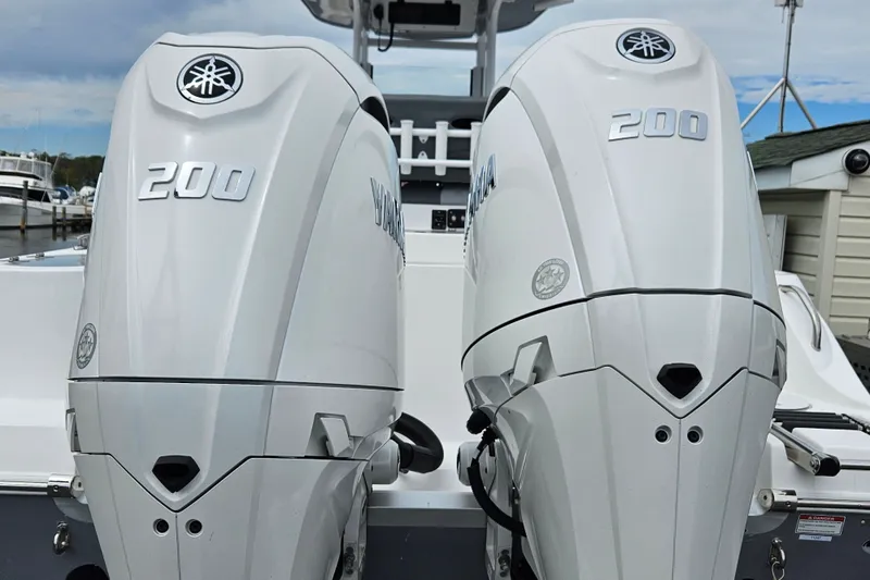 Slide: The Image of Twin Yamaha 200 outboard engines on a 2025 NauticStar 252 Legacy boat. - 2