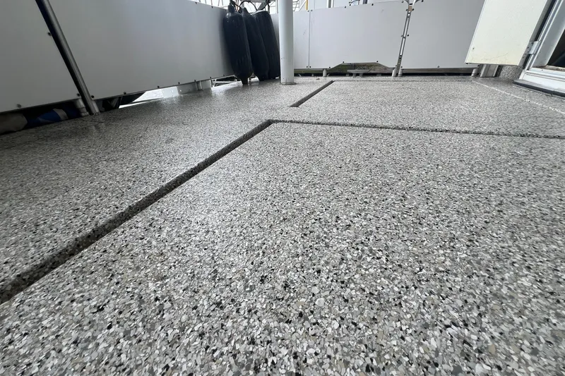 Slide: The Image of Granite-textured deck of a 1999 Fantasy 75' x 17' Custom boat. - 9
