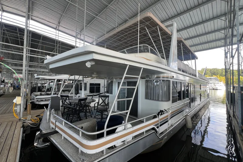 Slide: The Image of Houseboat docked in marina, Fantasy 75' x 17' Custom, 1999 model, under covered slip. - 4