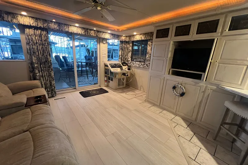 Slide: The Image of Luxurious interior of a 1999 Fantasy 75' x 17' Custom houseboat with modern amenities. - 23