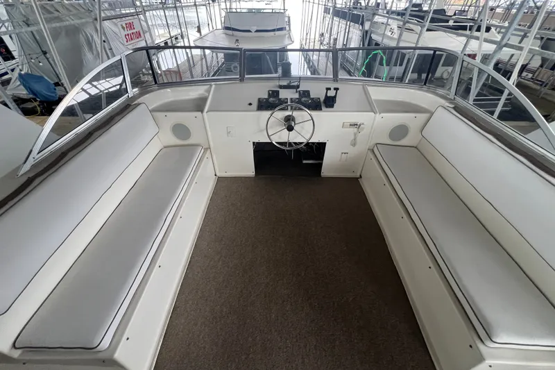 Slide: The Image of Interior view of a 1999 Fantasy 75' x 17' Custom boat helm with seating. - 12