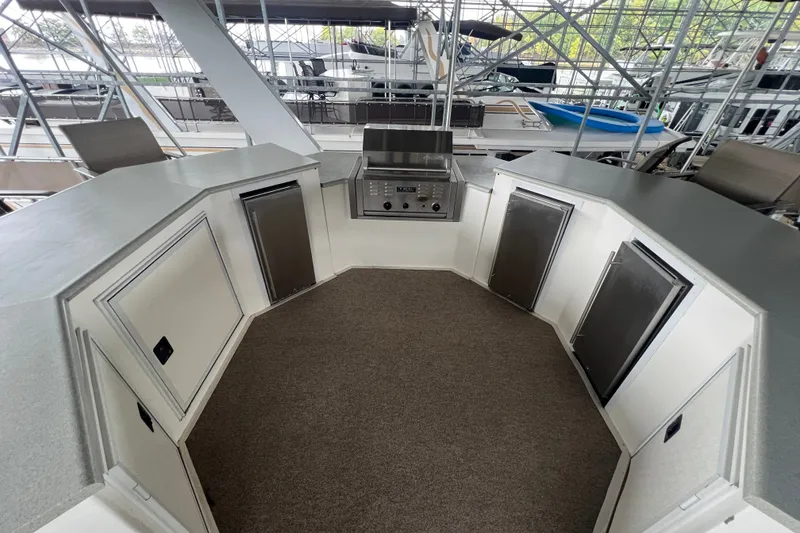 Slide: The Image of Outdoor kitchen on a 1999 Fantasy 75' x 17' Custom houseboat with grill and storage cabinets. - 11