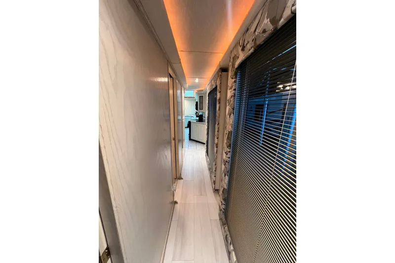 Slide: The Image of Narrow hallway in a 1999 Fantasy Custom houseboat with modern interior design. - 30
