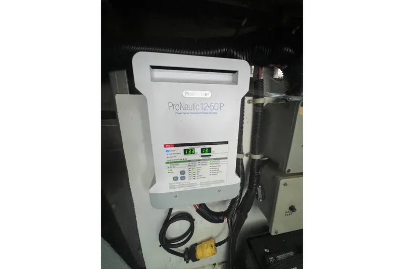 Slide: The Image of ProNautic 12-50P battery charger in a 1999 Fantasy 75' x 17' Custom boat. - 49