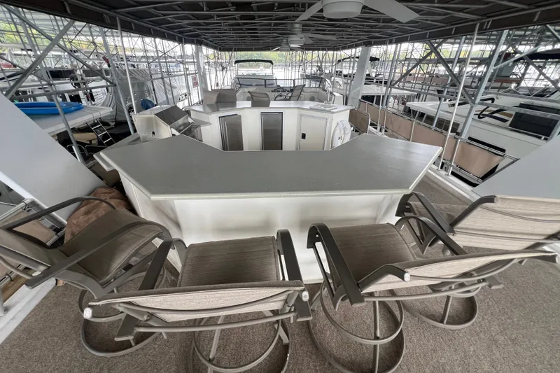 Slide: The Image of Luxurious 1999 Fantasy 75' x 17' Custom houseboat with spacious outdoor bar area. - 10