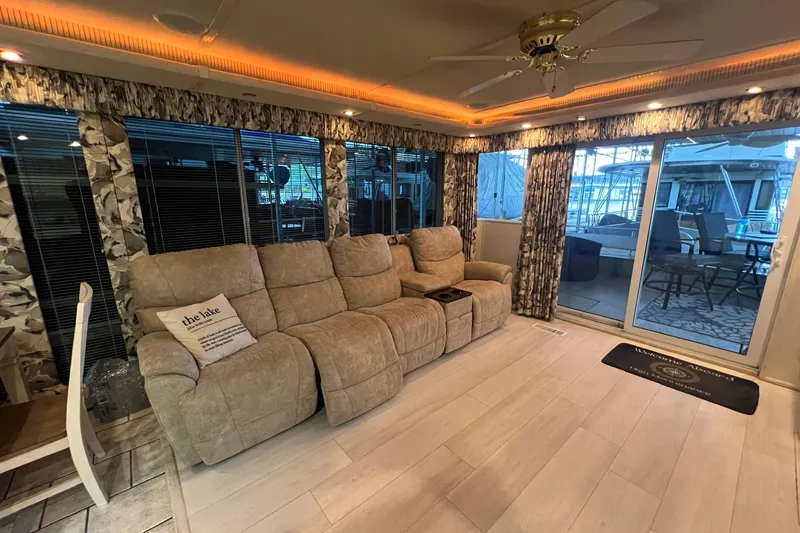 Slide: The Image of Luxurious interior of a 1999 Fantasy 75' x 17' Custom houseboat with plush seating and elegant decor. - 24