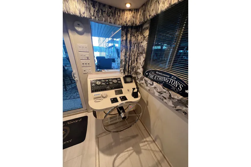 Slide: The Image of Control panel of a 1999 Fantasy 75' x 17' Custom boat with decorative interior. - 32