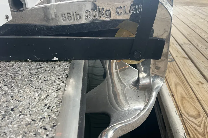 Slide: The Image of Chrome boat anchor labeled "66lb 30kg Claw" on a docked Fantasy Custom model. - 48