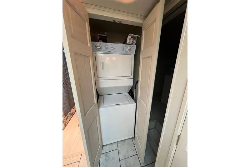 Slide: The Image of Stacked washer and dryer in a compact laundry closet, Fantasy 75' x 17' Custom, 1999. - 47