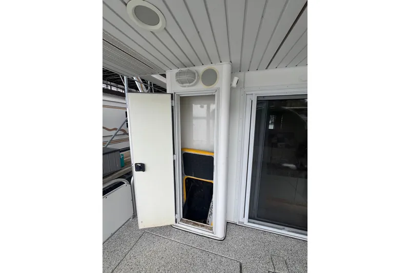 Slide: The Image of Interior view of a 1999 Fantasy 75' x 17' Custom boat with open door and sliding window. - 22
