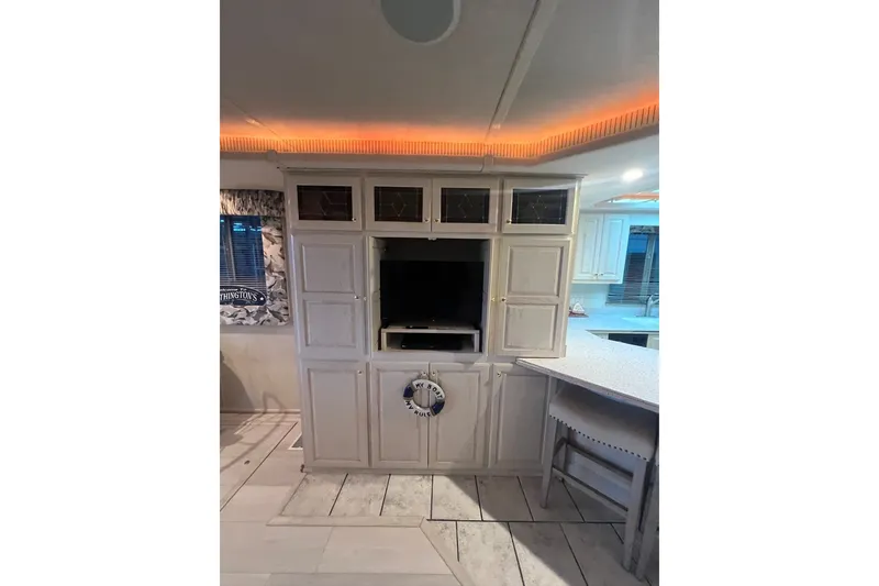 Slide: The Image of Interior of a 1999 Fantasy 75' x 17' Custom houseboat with built-in cabinetry and TV. - 26