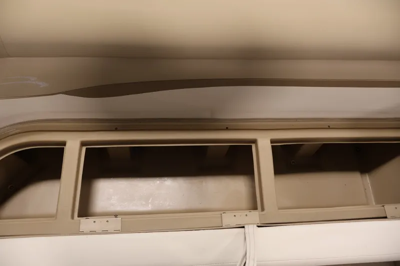 Slide: The Image of Interior storage compartments of a 2017 Bennington 21 SL boat. - 14