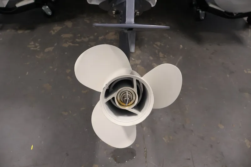 Slide: The Image of Propeller of a 2017 Bennington 21 SL boat on a workshop floor. - 34