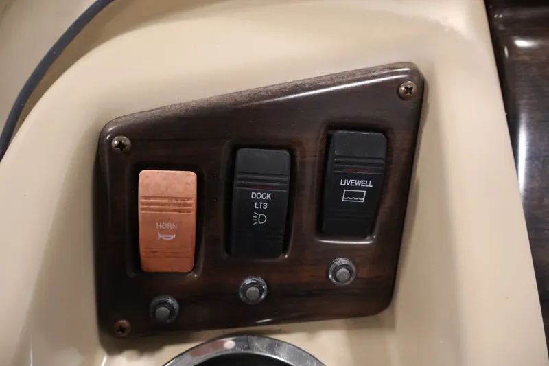 Slide: The Image of Control panel of a 2017 Bennington 21 SL boat with horn, dock lights, and livewell switches. - 20