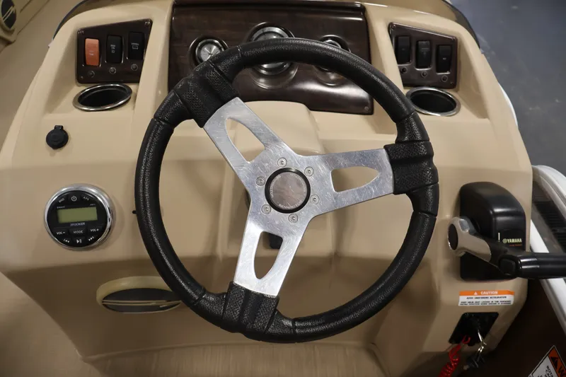Slide: The Image of Steering wheel and dashboard of 2017 Bennington 21 SL boat. - 18