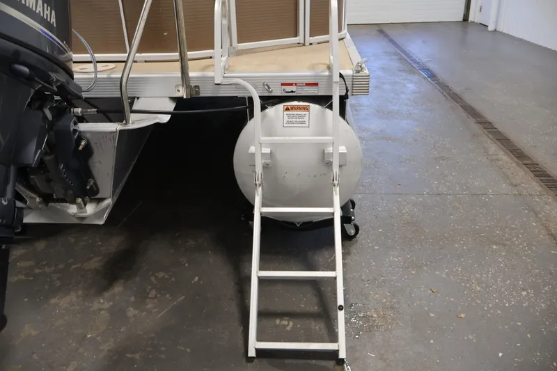 Slide: The Image of Rear view of a 2017 Bennington 21 SL boat with ladder and Yamaha motor. - 30
