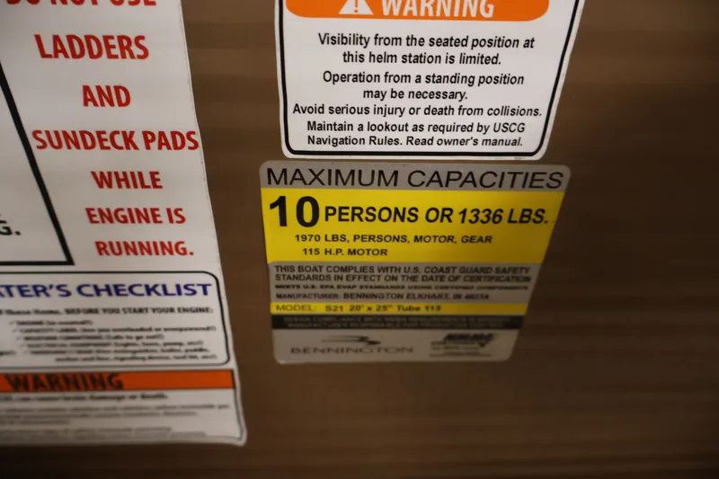 Slide: The Image of Safety and capacity labels on a 2017 Bennington 21 SL boat. - 23