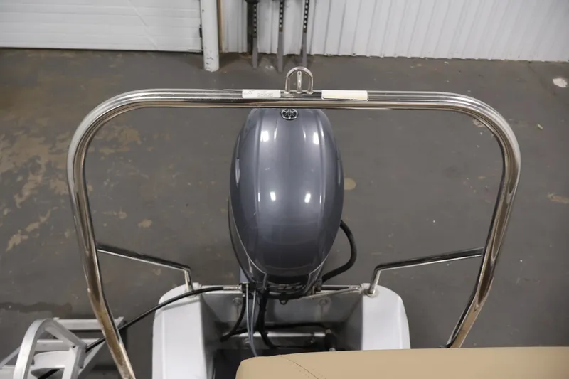 Slide: The Image of 2017 Bennington 21 SL boat with outboard motor and stainless steel railing. - 29