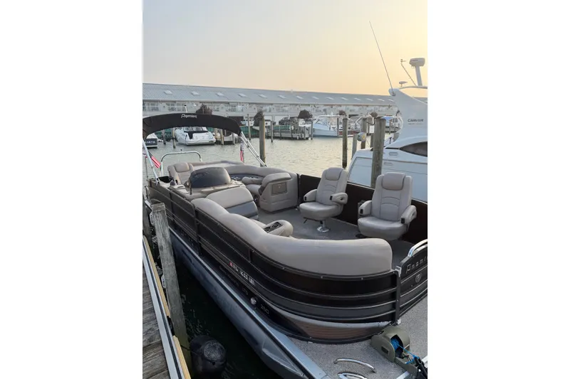 The Image of 2012 Premier 250 Grand Majestic LTD pontoon boat docked at marina. - 1