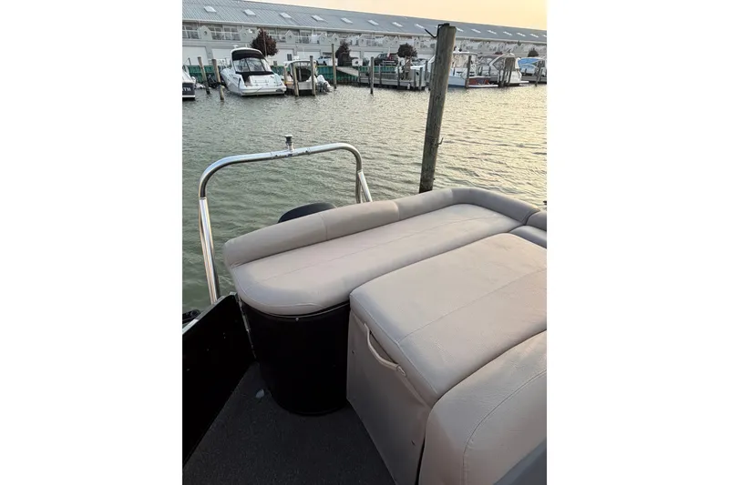 Slide: The Image of Premier 250 Grand Majestic LTD 2012 boat with beige seating at a marina. - 14