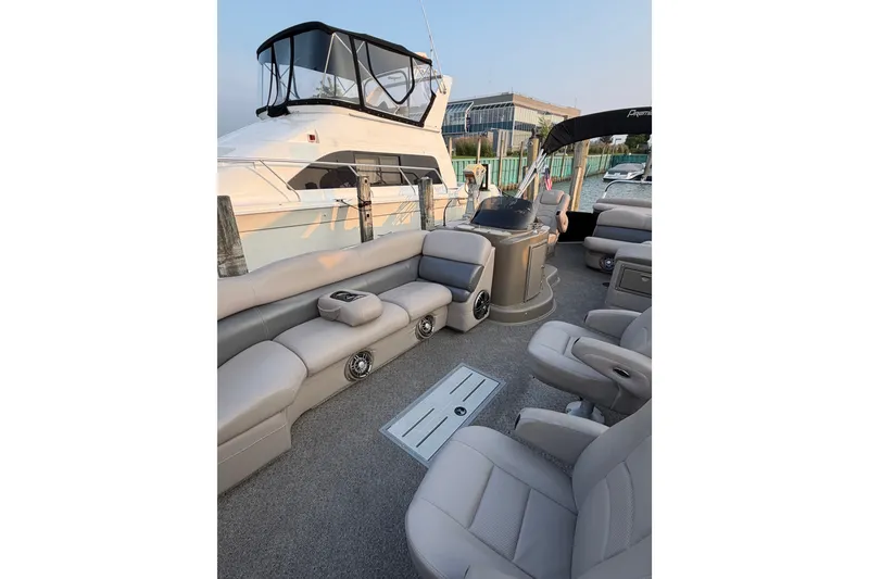 Slide: The Image of Luxurious 2012 Premier 250 Grand Majestic LTD pontoon boat interior with plush seating. - 7