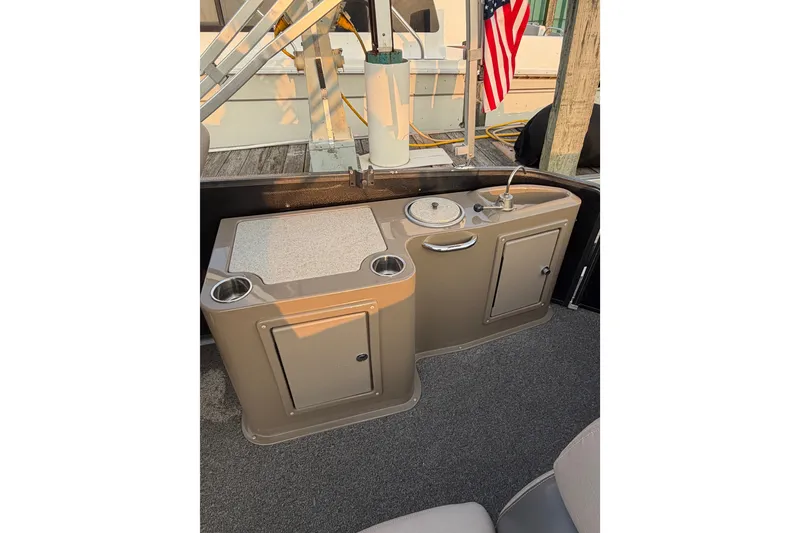 Slide: The Image of Interior of 2012 Premier 250 Grand Majestic LTD boat with sink and storage. - 12