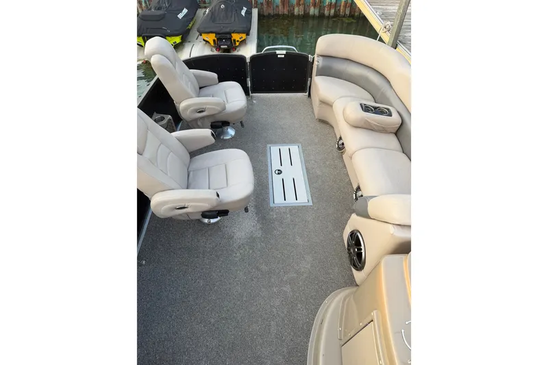 Slide: The Image of Luxurious interior of 2012 Premier 250 Grand Majestic LTD pontoon boat with plush seating. - 19