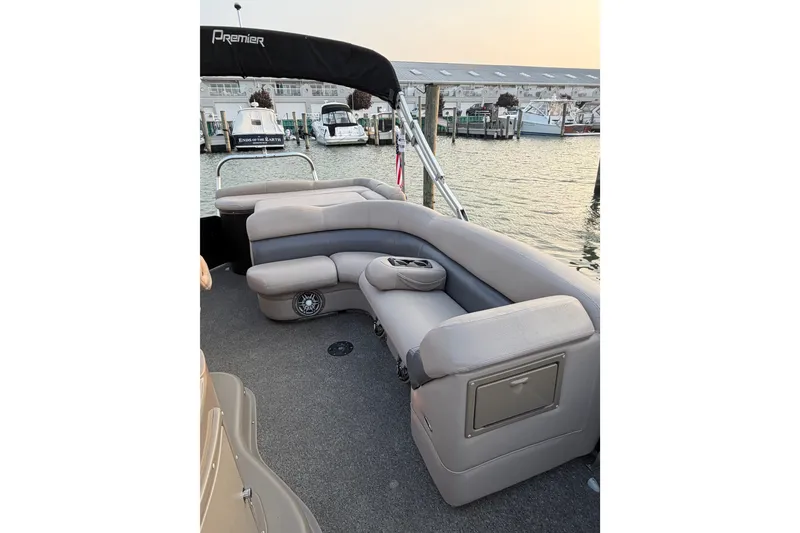 Slide: The Image of Luxurious seating on 2012 Premier 250 Grand Majestic LTD pontoon boat at marina. - 9