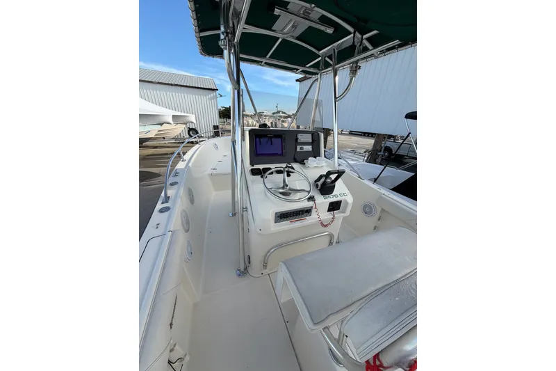 Slide: The Image of 2001 Pursuit 2470 Center Console boat with navigation equipment and seating. - 6