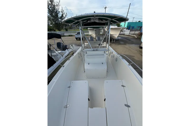 Slide: The Image of 2001 Pursuit 2470 Center Console boat with spacious deck and T-top canopy. - 10